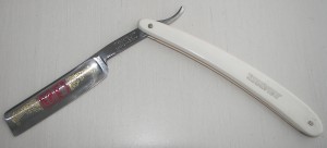 Straight razor, single double edged blade. Requires sharpening before use.